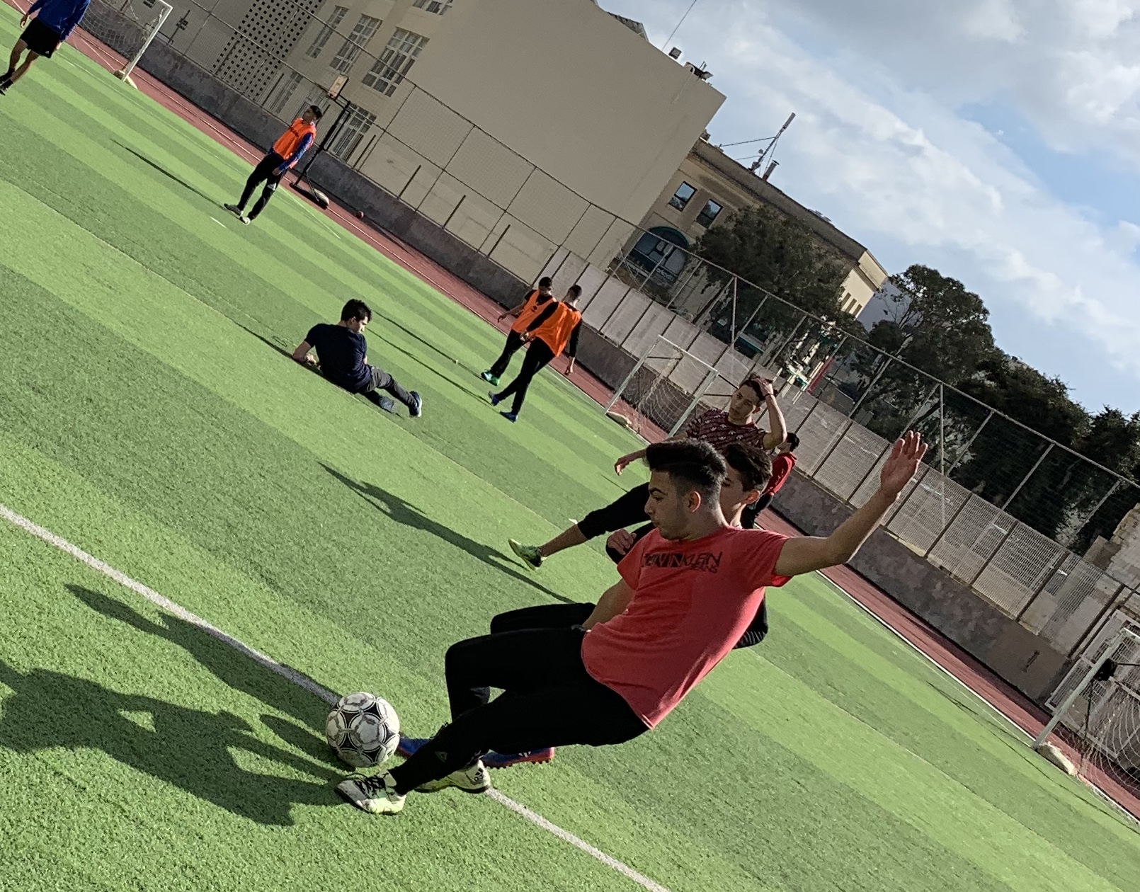 Another picutre of a student playing football.