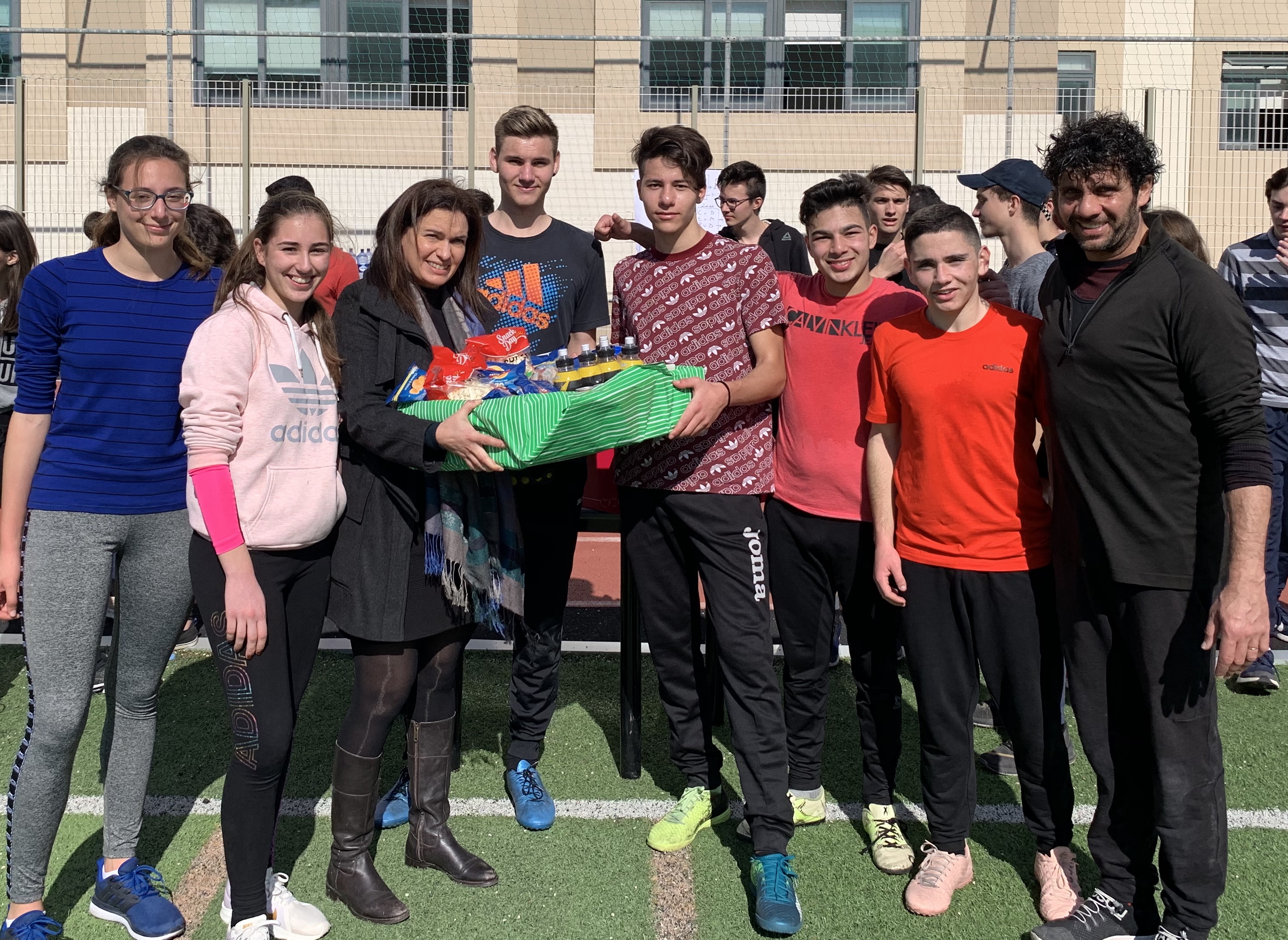 image showing students being presented with a trophy during the Sports and Fitness activity