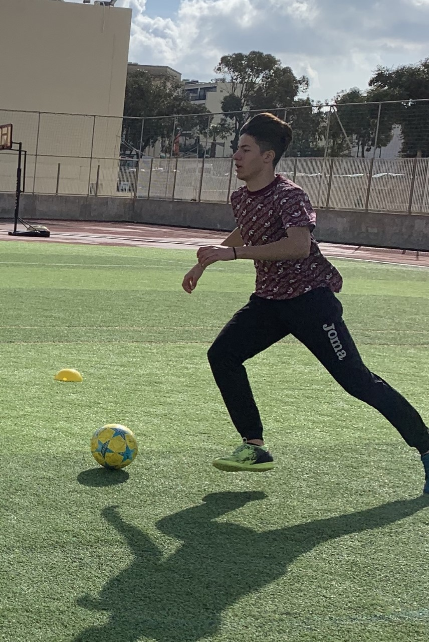 a student playing football