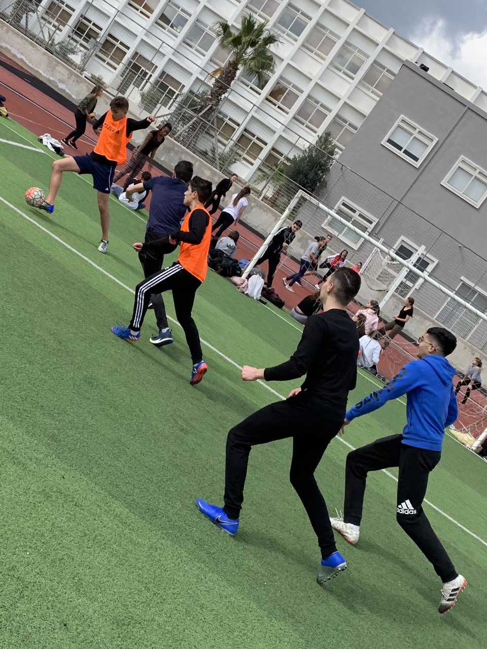 two football teams playing a match during P.E.